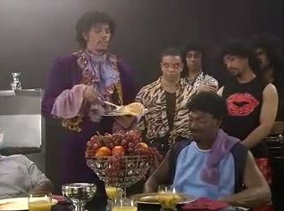 Dave Chapelle as Prince serving pancakes.jpg