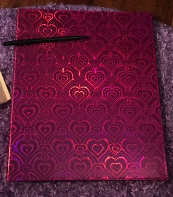 I chose a pink holographic binder because I wanted something to symbolize my love for myself and my craft but look &quot;ordinary&quot;-- and to show that things aren't always what they appear.