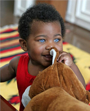 Laren Galloway, African-American with bright blue eyes.